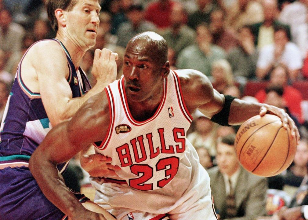 Michael Jordan drives toward the basket past Jeff Hornacek