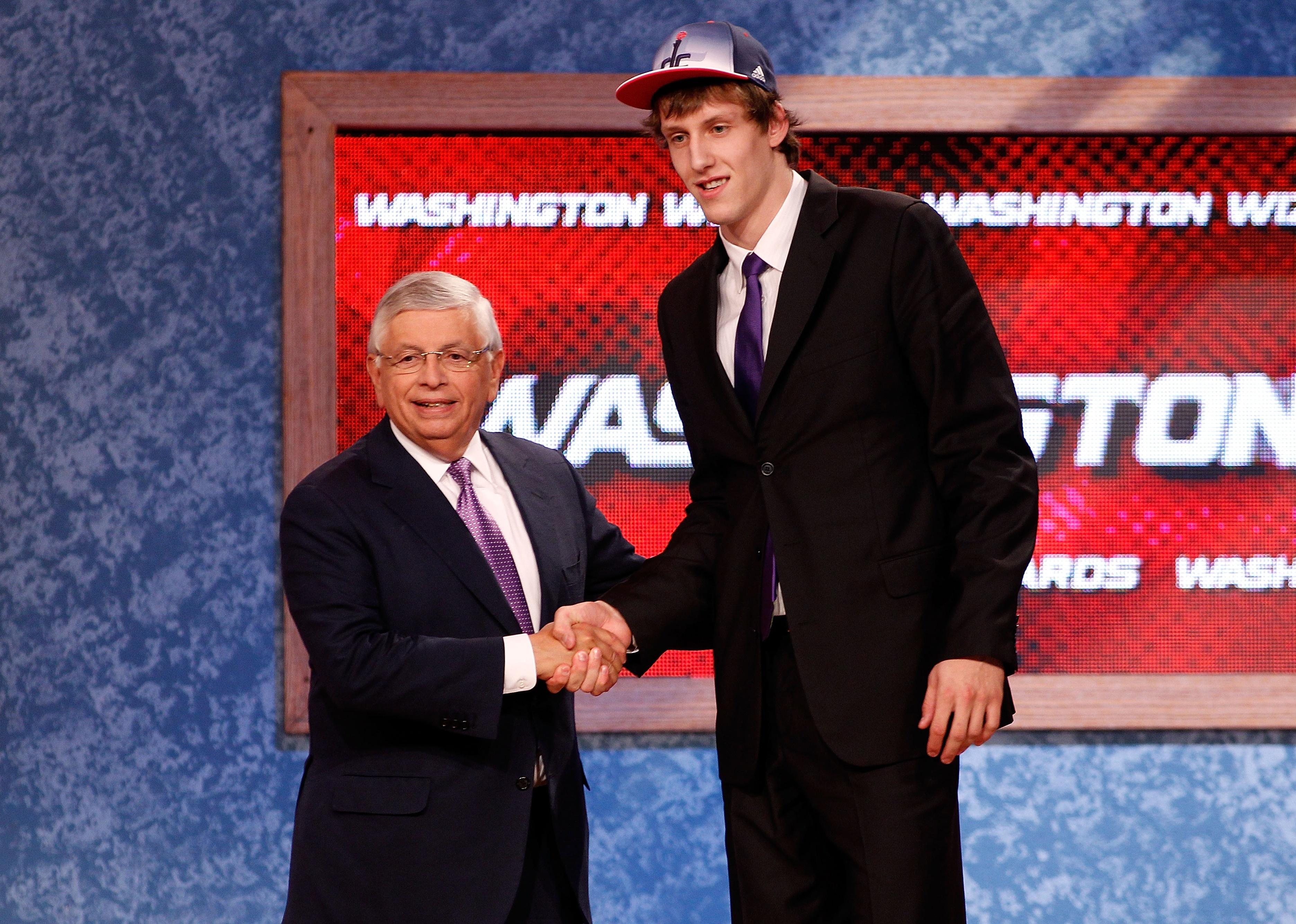 Jan Vesely shaking hands with NBA Commissioner David Stern.