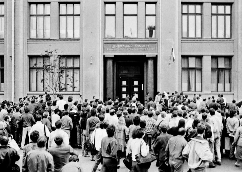 People stand in front of the Communist Party of the Soviet Union central office in Moscow.
