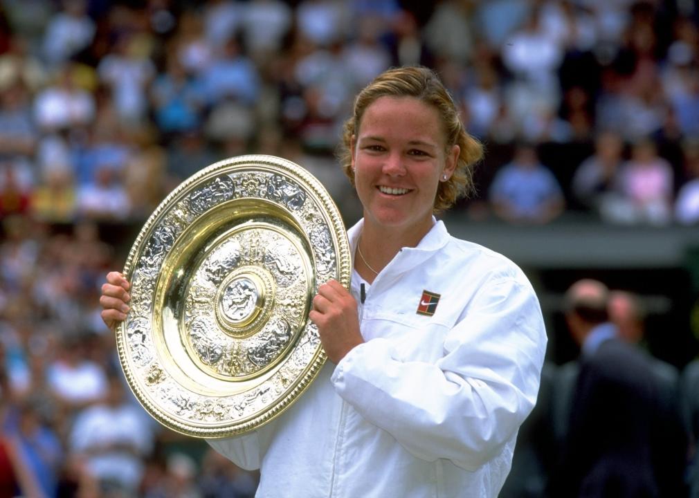 Lindsay Davenport of the United States lifts the trophy after winning the Wimbledon Ladies Singles Championship