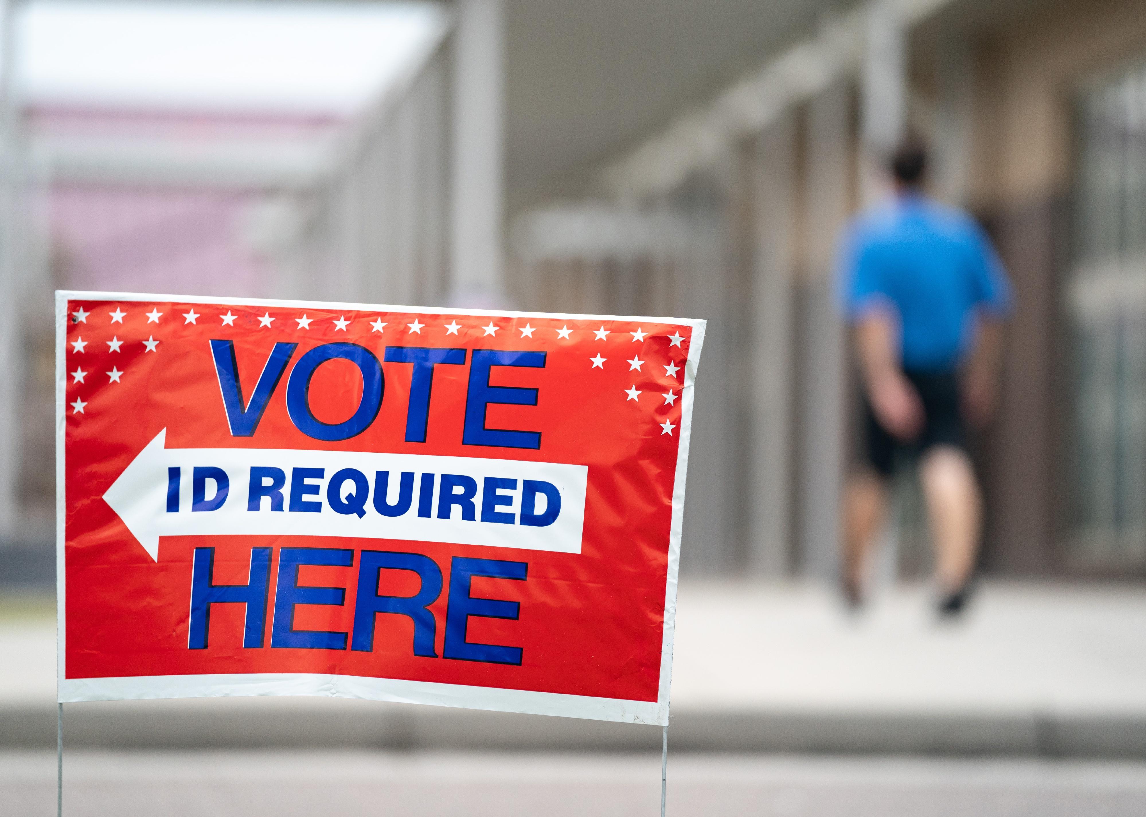 A sign directs voters during midterm primary elections on June 14, 2022 in Summerville, South Carolina