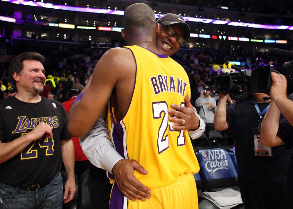 Kobe Bryant hugs his father, Joe Bryant.