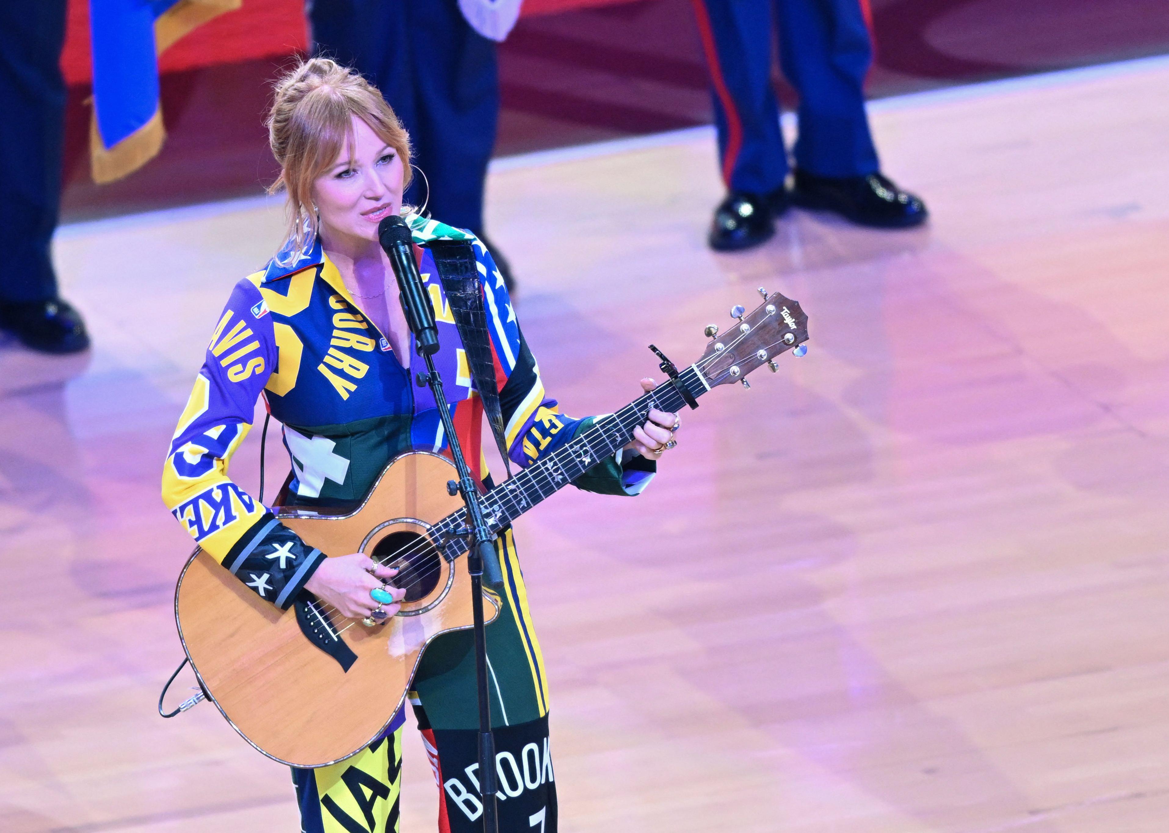 Jewel performs the National Anthem ahead of the NBA All-Star game.