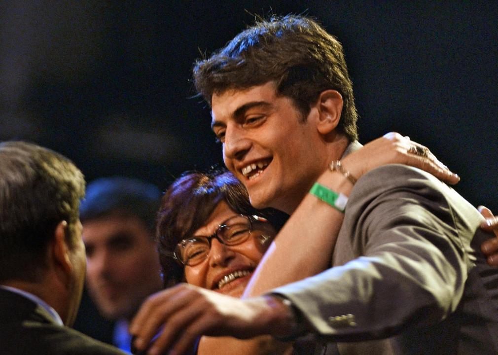 Nikoloz Tskitishvili of Georgia celebrates with family members after he was chosen as the fifth pick.