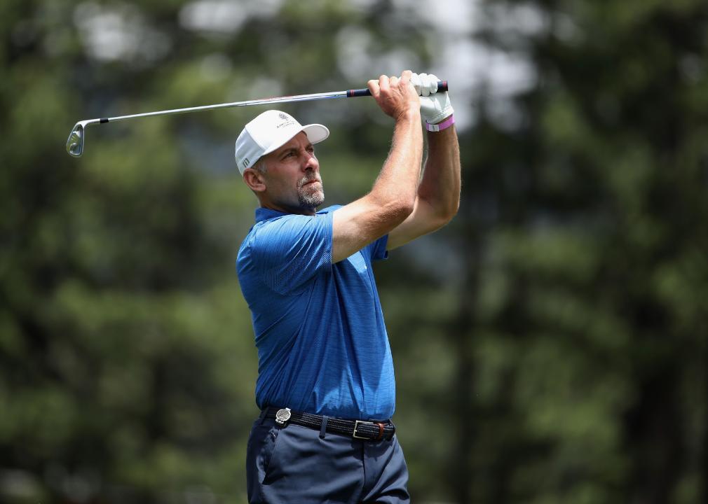 MLB athlete John Smoltz plays a tee shot on the fifth hole