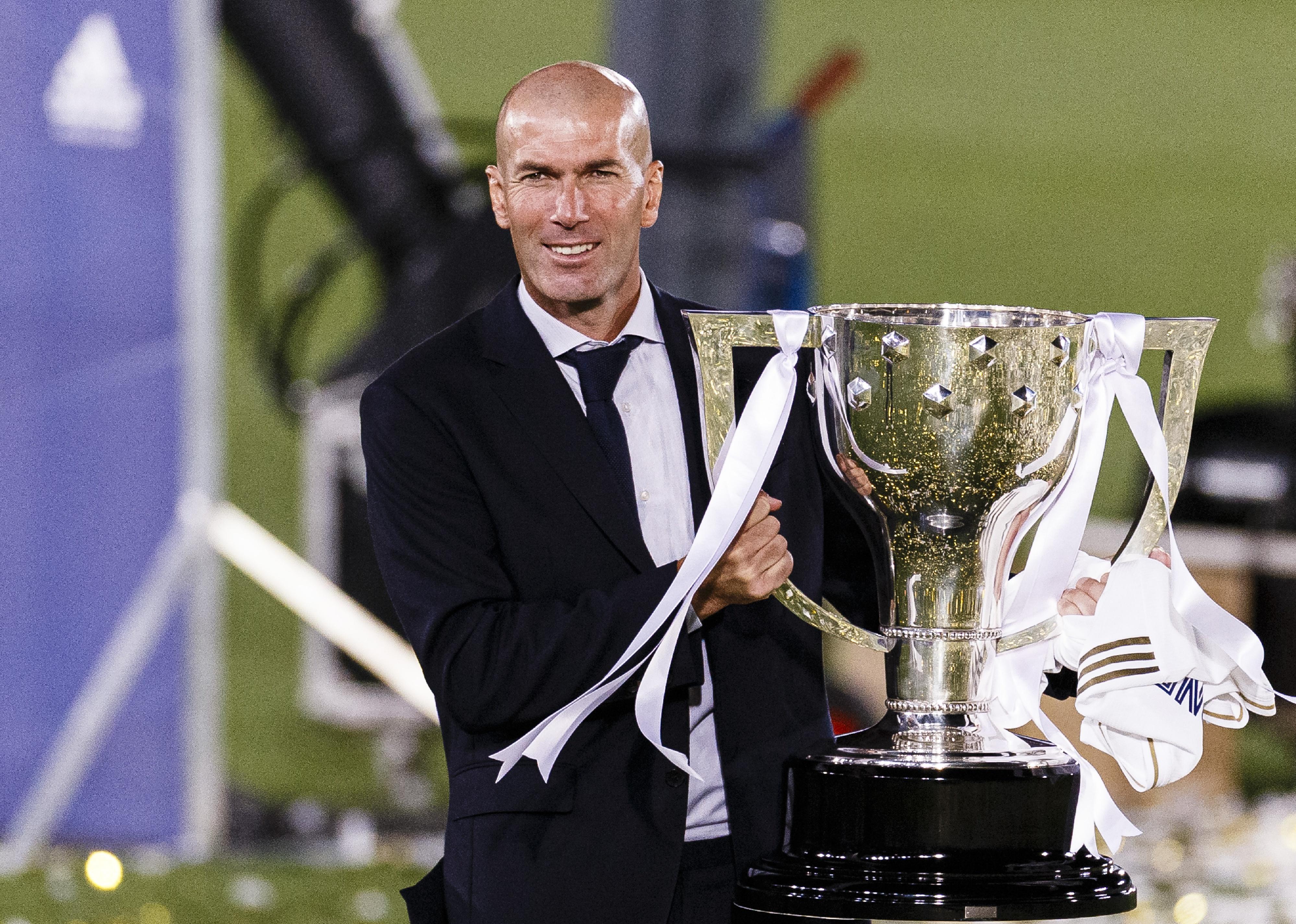 Zinedine Zidane head coach of Real Madrid celebrates with the La Liga trophy