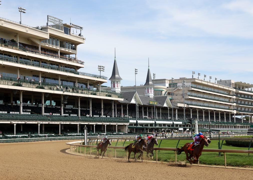 A general view of empty grandstands as horses run on the track
