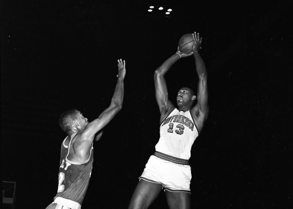 Wilt Chamberlain shoots the ball