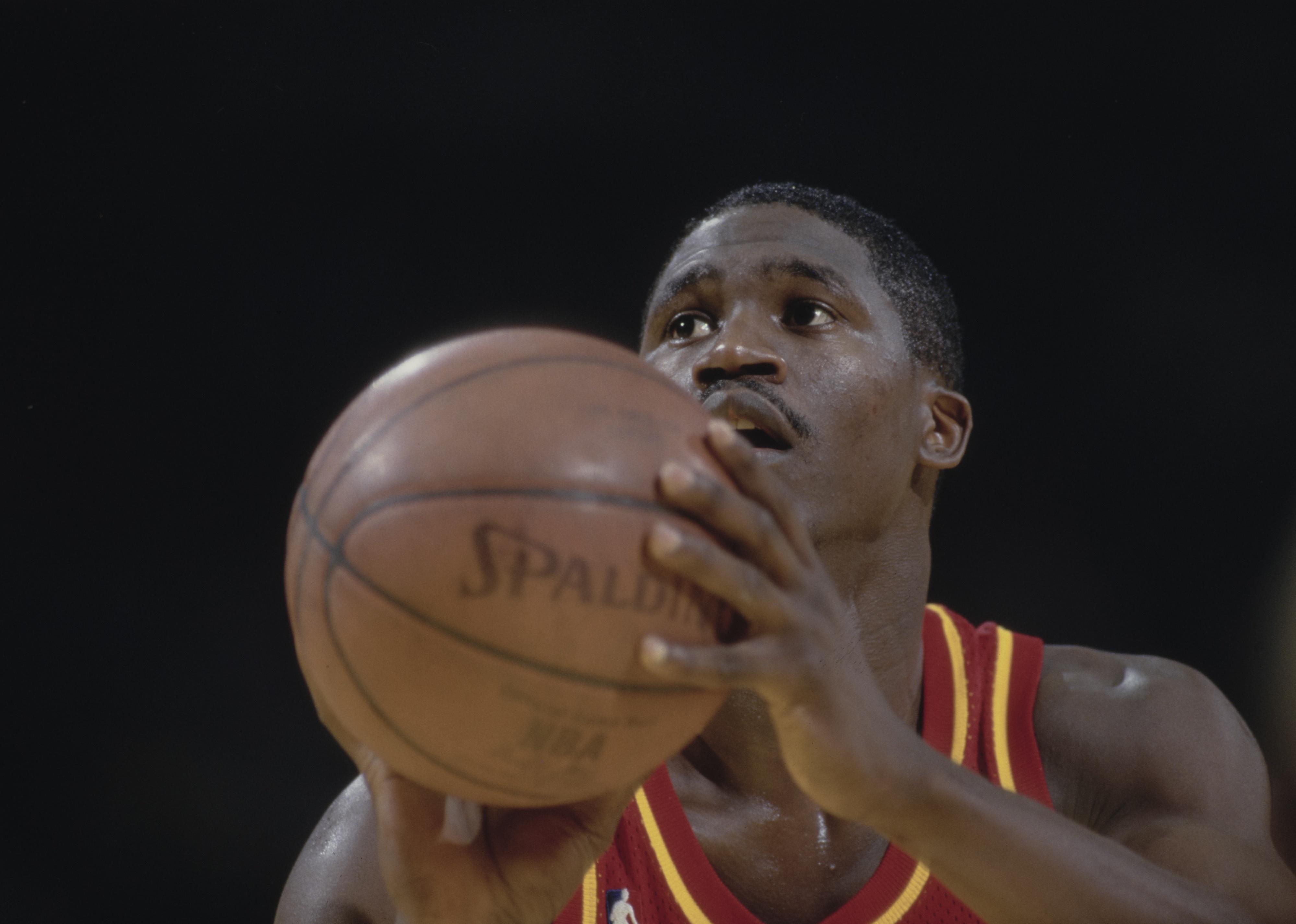 Dominique Wilkins prepares to shoot a free throw during a game.