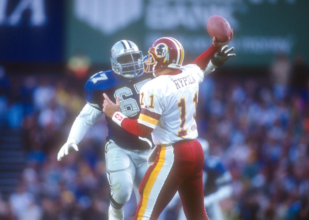 Russell Maryland of the Dallas Cowboys puts pressure on Mark Rypien of the Washington Redskins