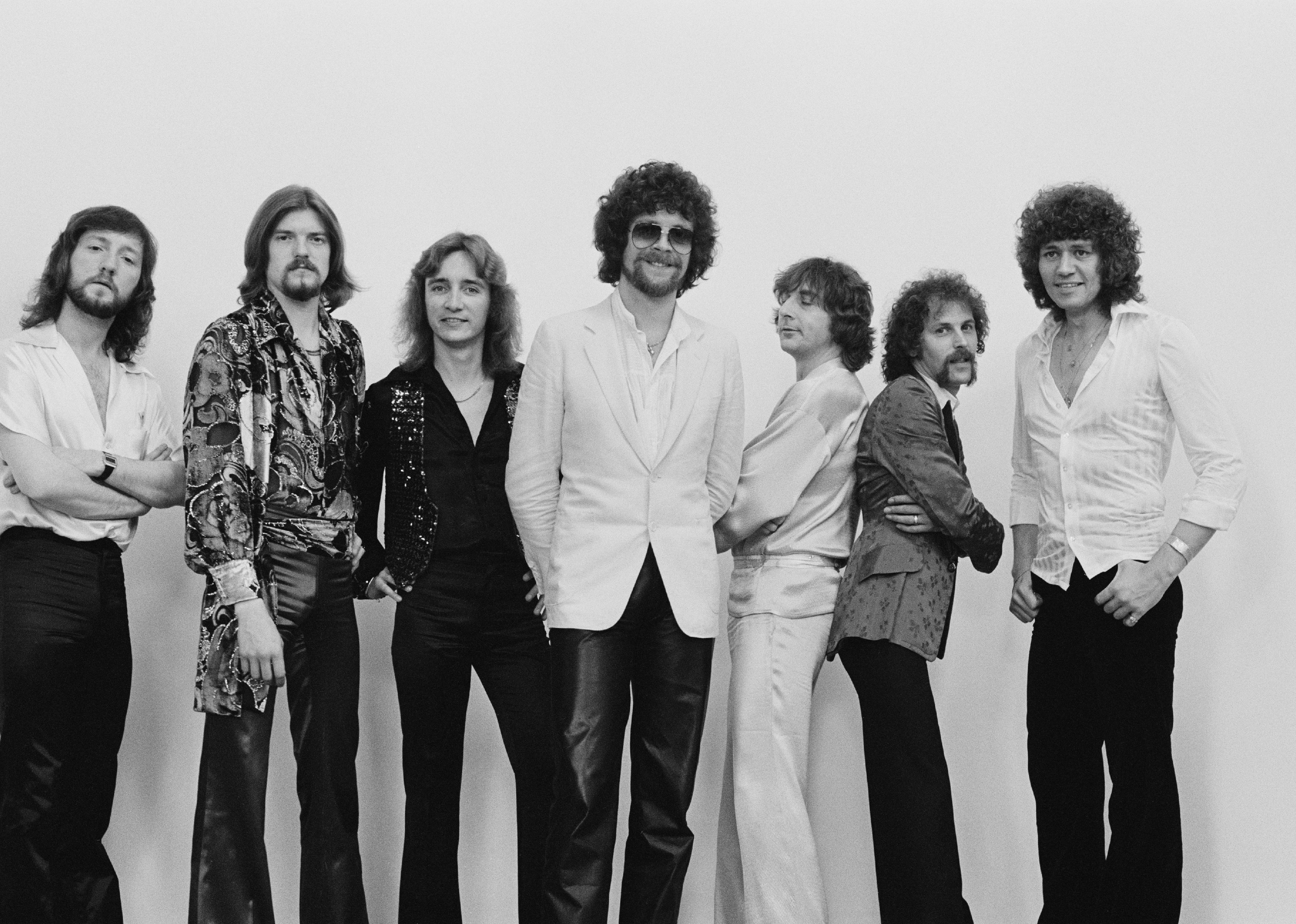 Electric Light Orchestra posed on the set of a video shoot.