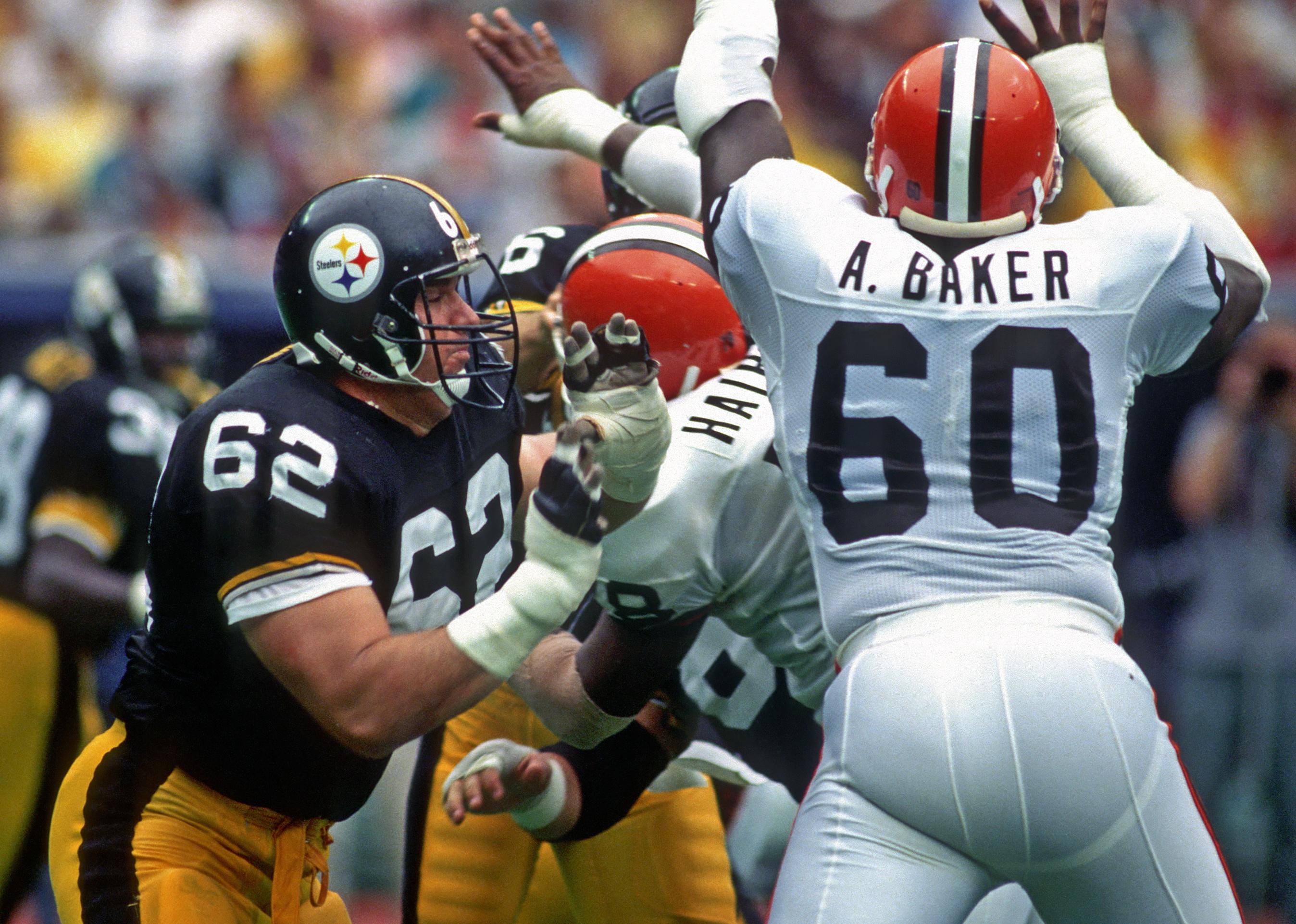 Offensive lineman Tunch Ilkin of the Pittsburgh Steelers blocks defensive lineman Al Baker #60 of the Cleveland Browns.