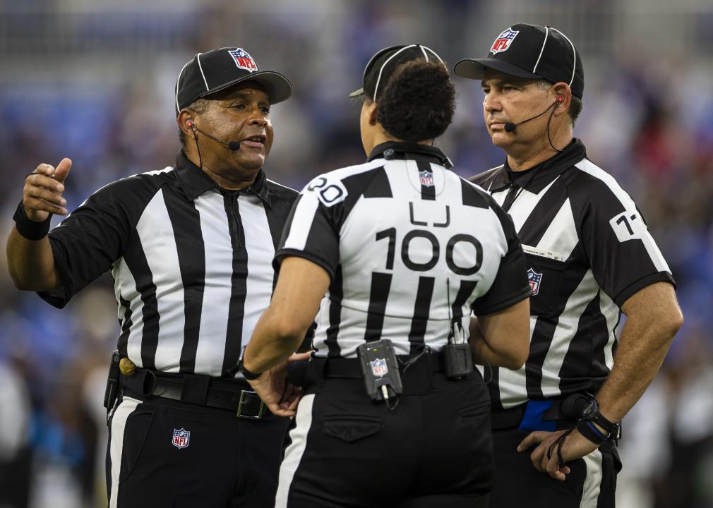 NFL officials meet to discuss a play during the first half of a preseason game