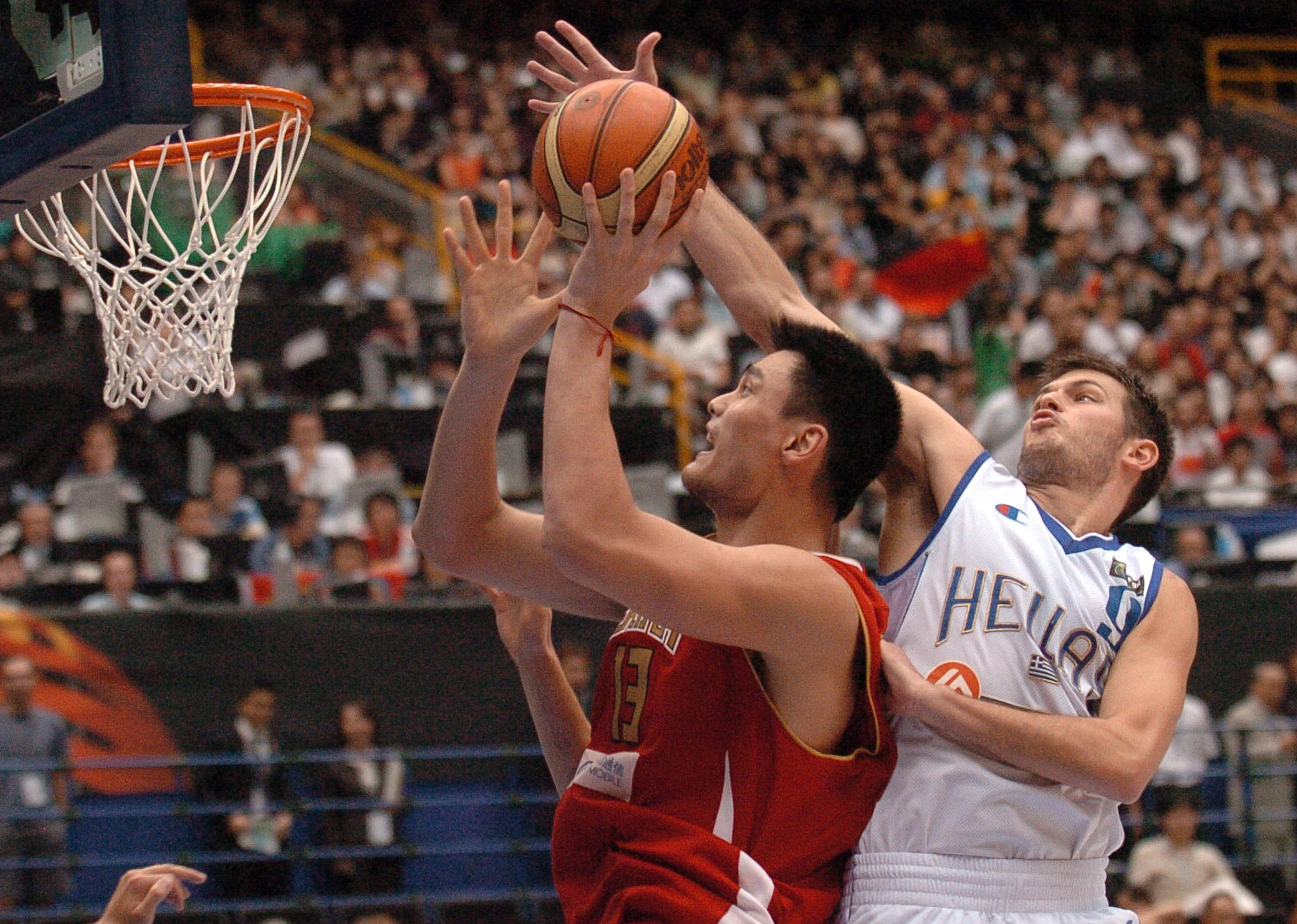 Antonis Fotsis of Greece blocks China's Yao Ming during the Final Eight round of the 2006 FIBA World Championships.