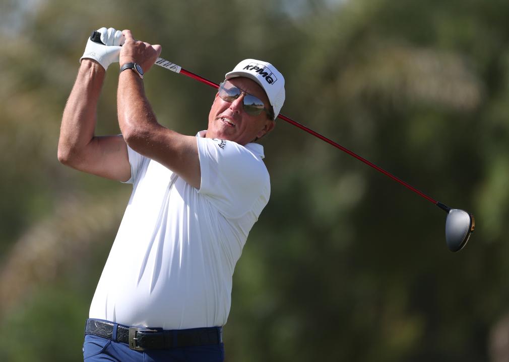 Phil Mickelson tees off a hole