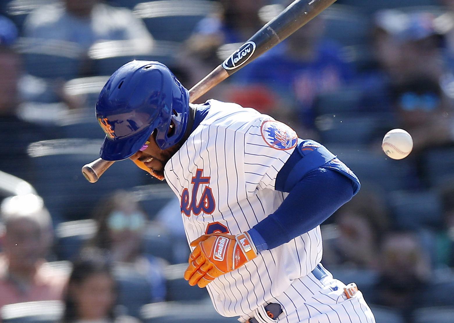 Starling Marte of the New York Mets is hit by a pitch/