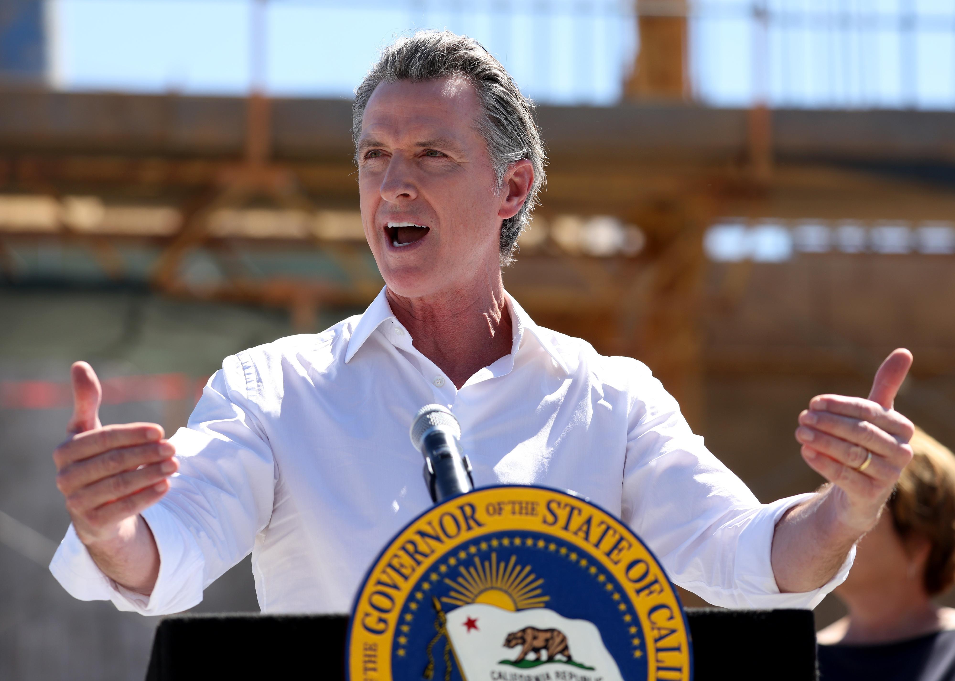 California Gov. Gavin Newsom speaks to reporters
