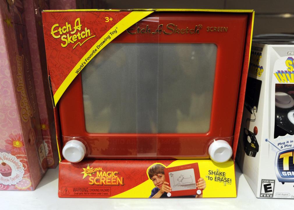 An Etch a Sketch toy displayed on store shelf.