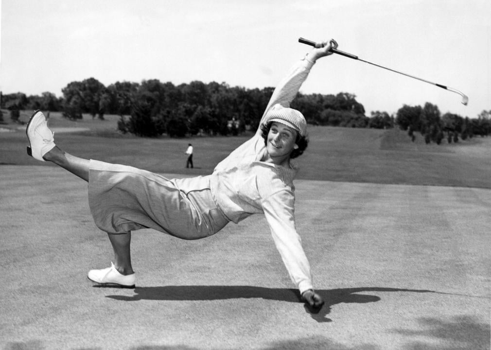 Babe Didrikson Zaharias in a sideways pose after putting