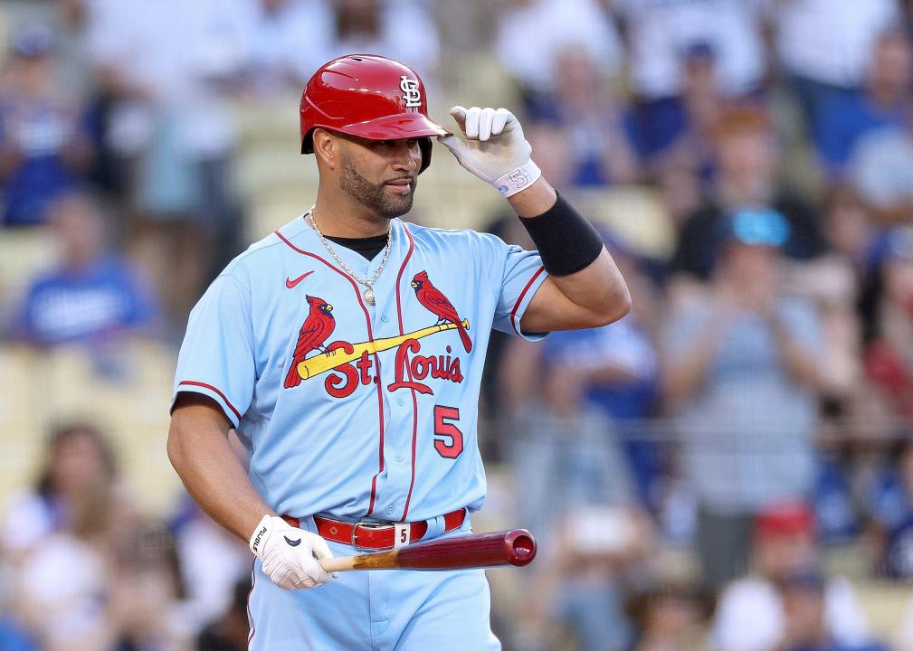 Albert Pujols #5 of the St. Louis Cardinals gestures to the applause of the crowd.