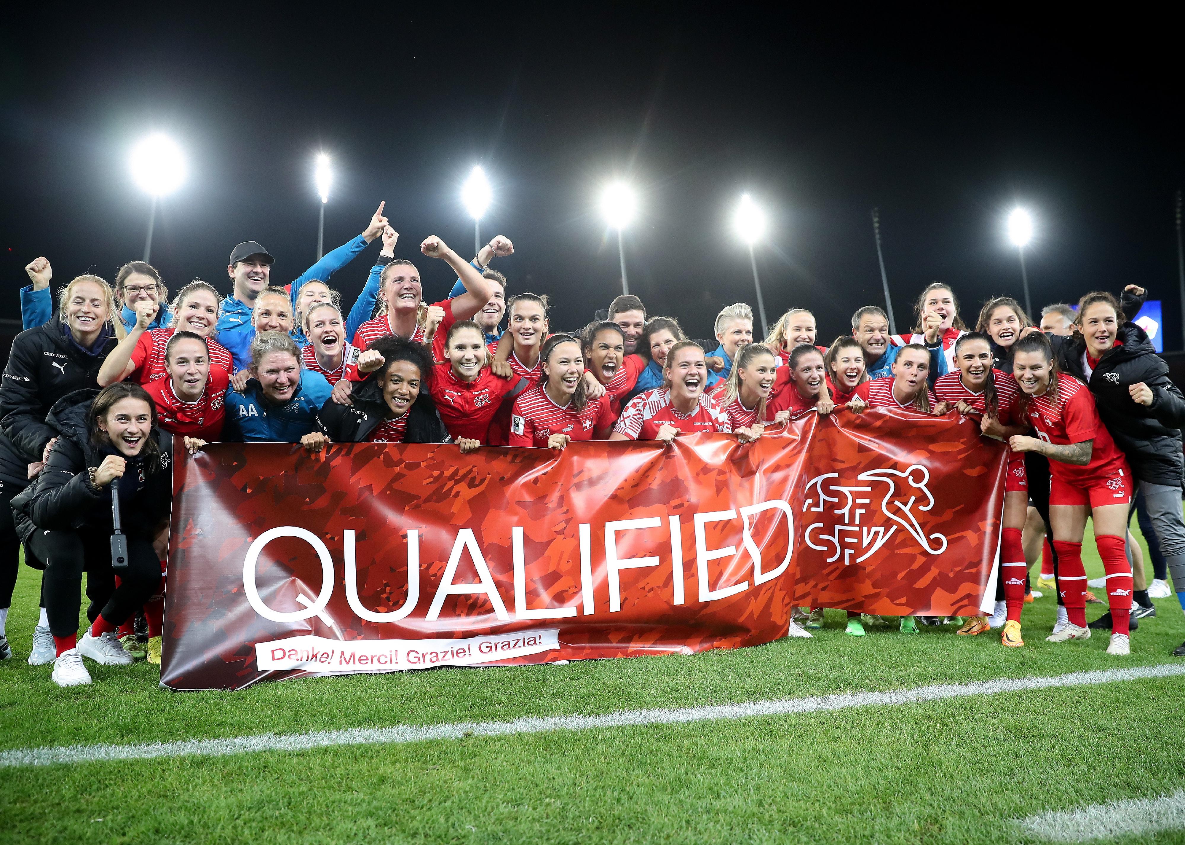 Players of Switzerland celebrate after their side's victory, resulting in qualification for the 2023 FIFA Women's World Cup.
