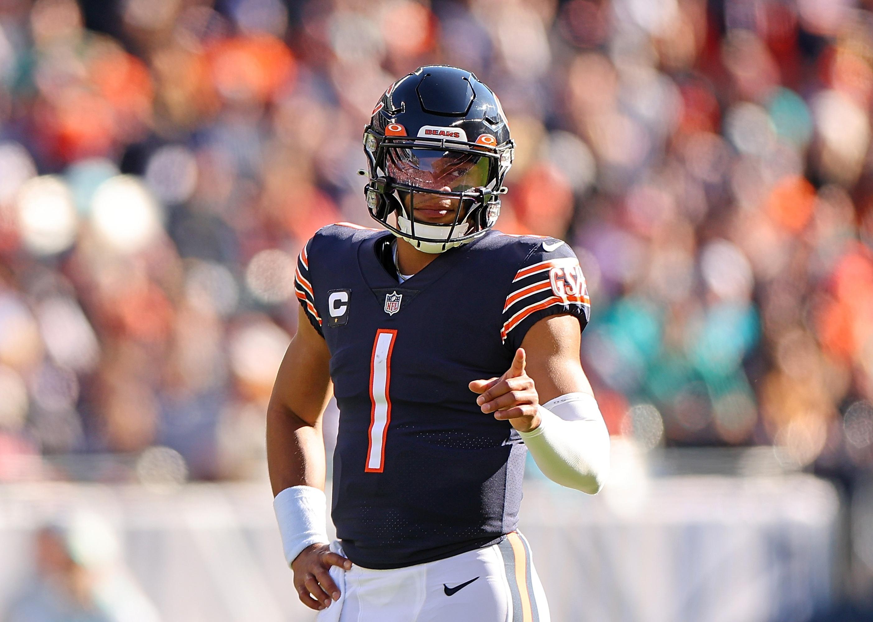 Justin Fields #1 of the Chicago Bears reacts after a play.