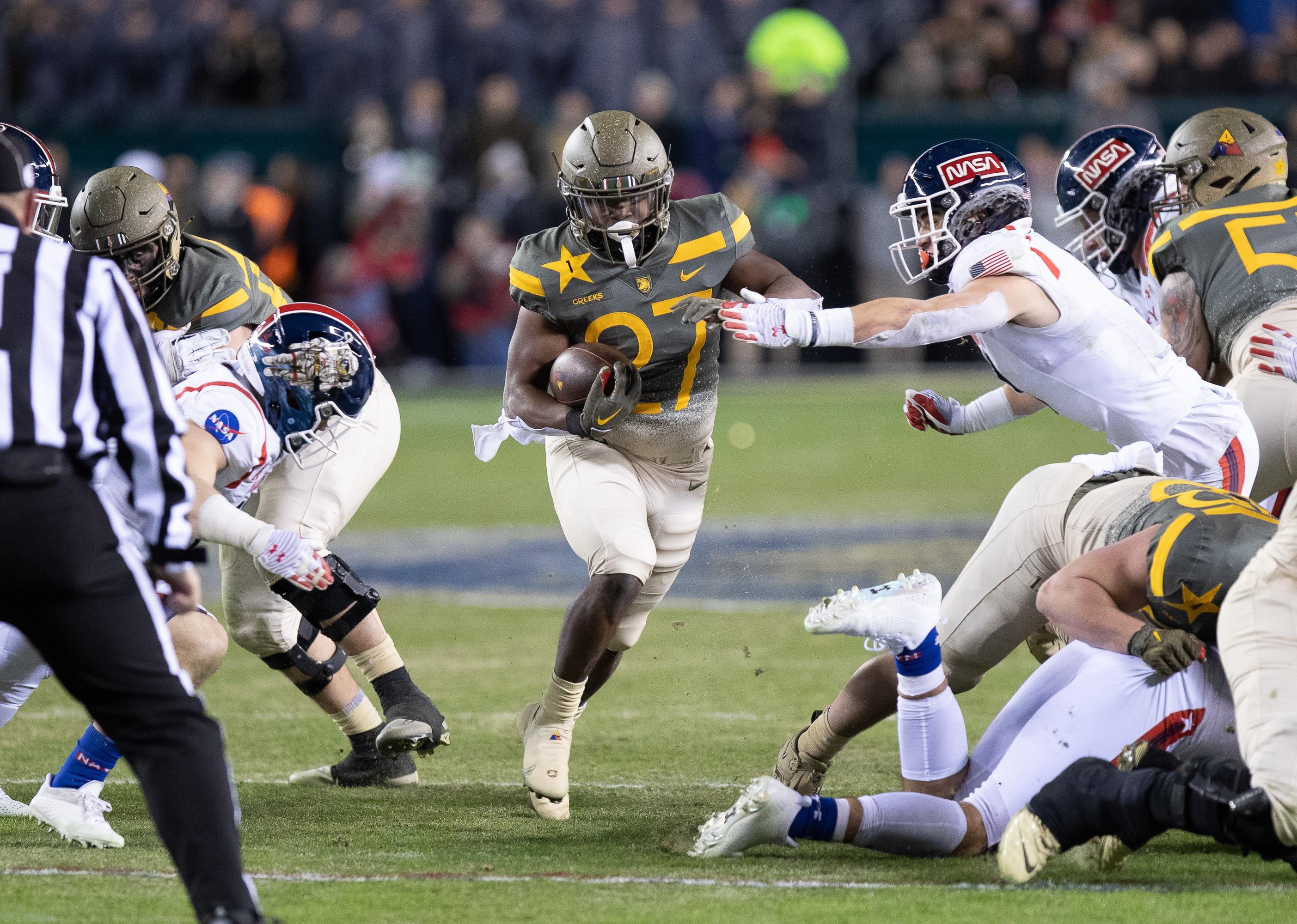 Markel Johnson of the Army Black Knights runs for a touchdown against the Navy Midshipmen.