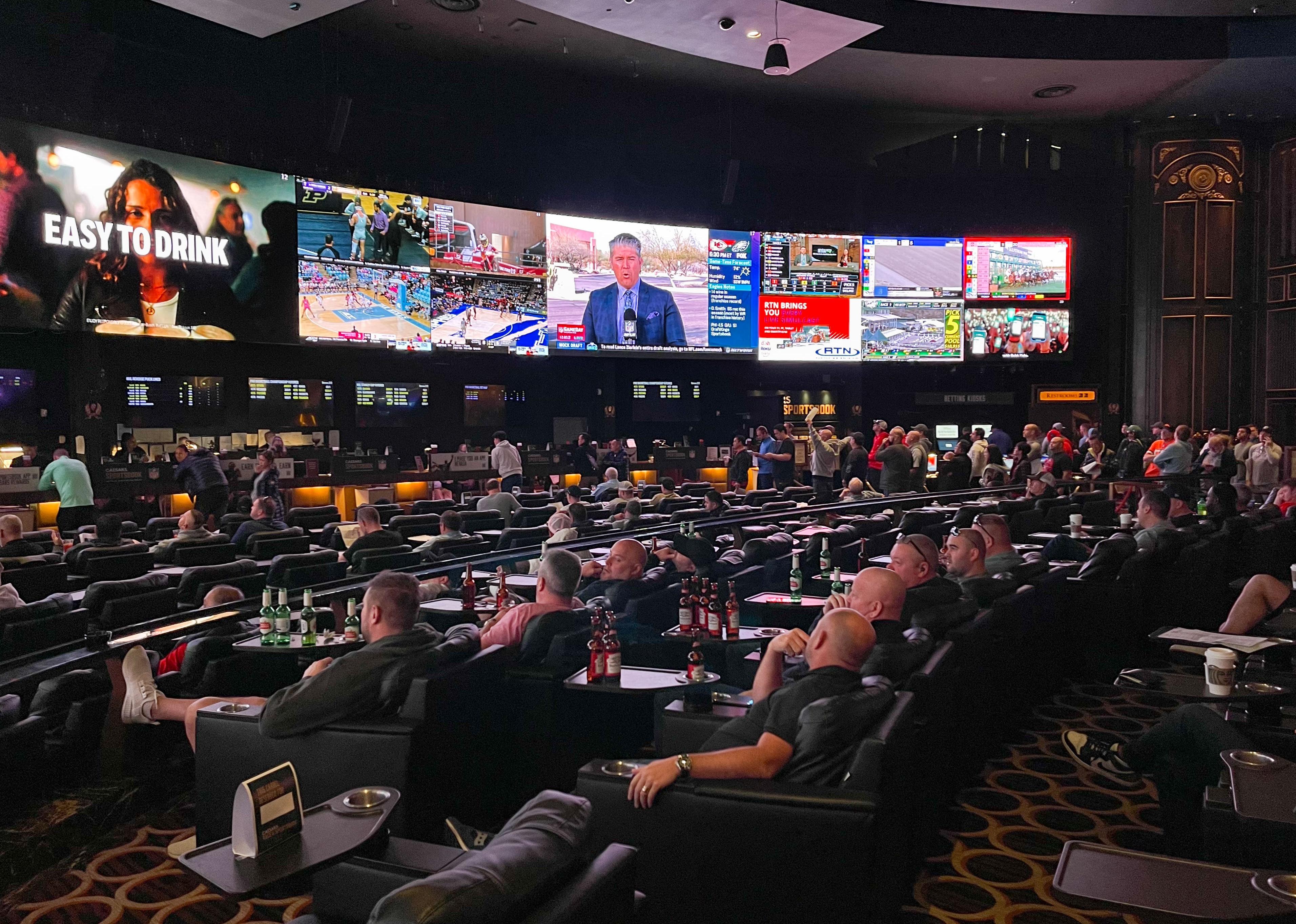 Gamblers in the Caesars Sports Book at Caesars Palace Hotel & Casino for the Super Bowl LVII.