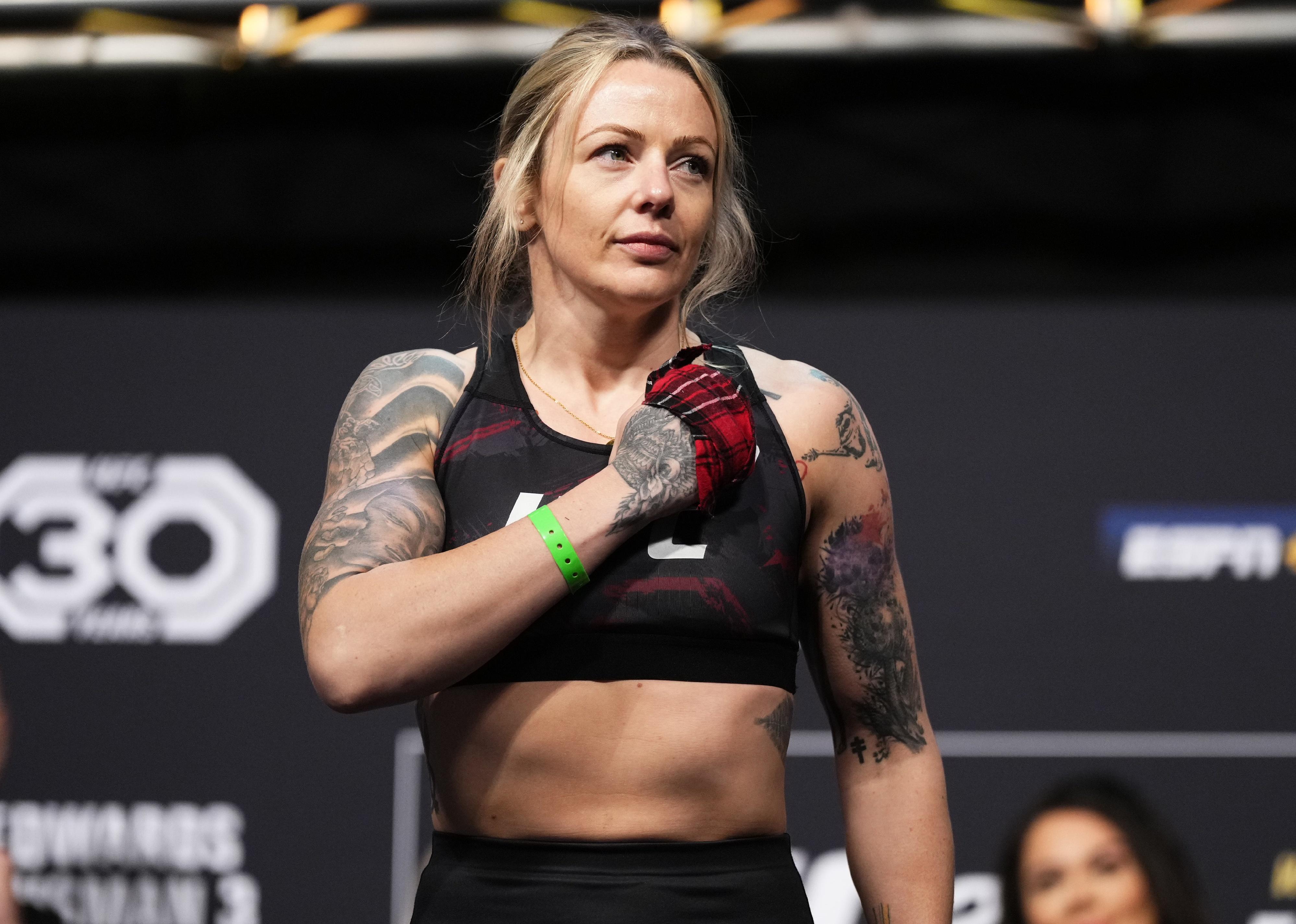 Joanne Wood poses on the scale during the UFC 286 ceremonial weigh-in at The O2 Arena.