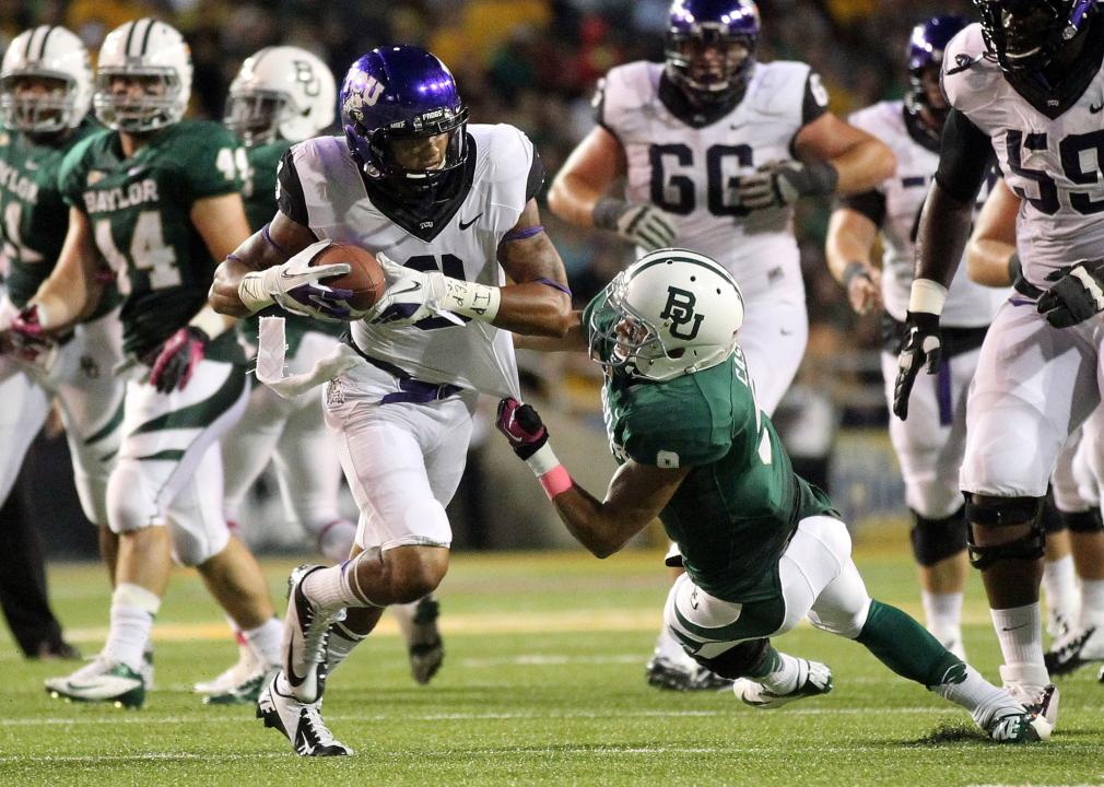 Trevone Boykin of the Texas Christian University Horned Frogs is tackled by Chance Casey of the Baylor University Bears