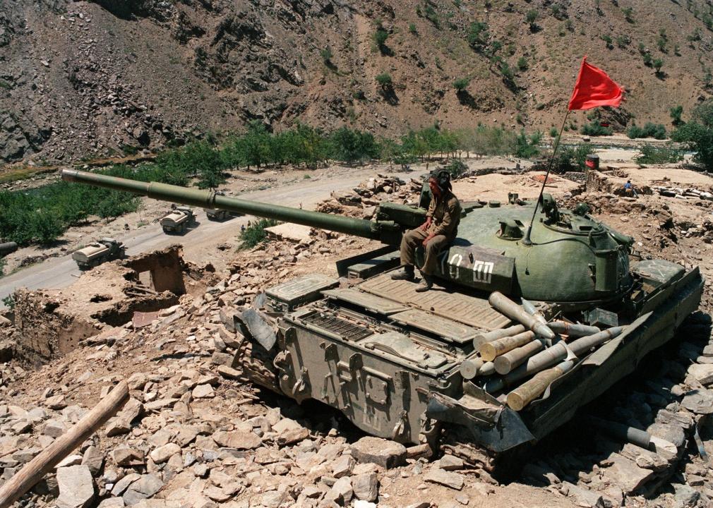 An Afghan solider sits on a Soviet tank near Salang Pass.