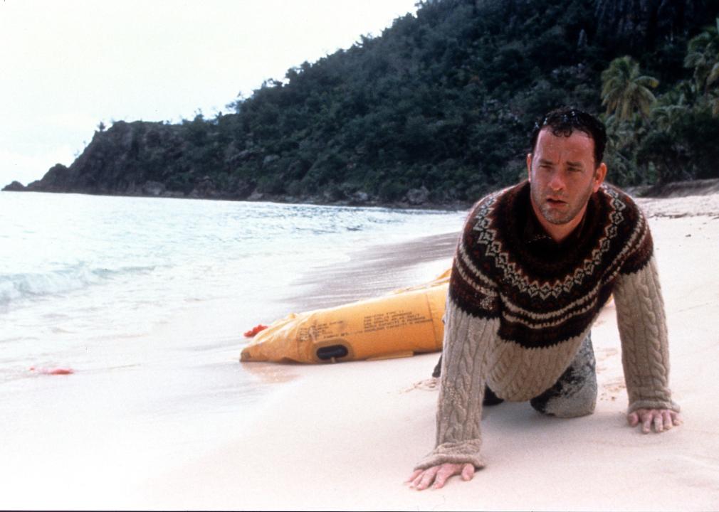 Tom Hanks washed up on the beach of an island in a scene from 'Cast Away'.
