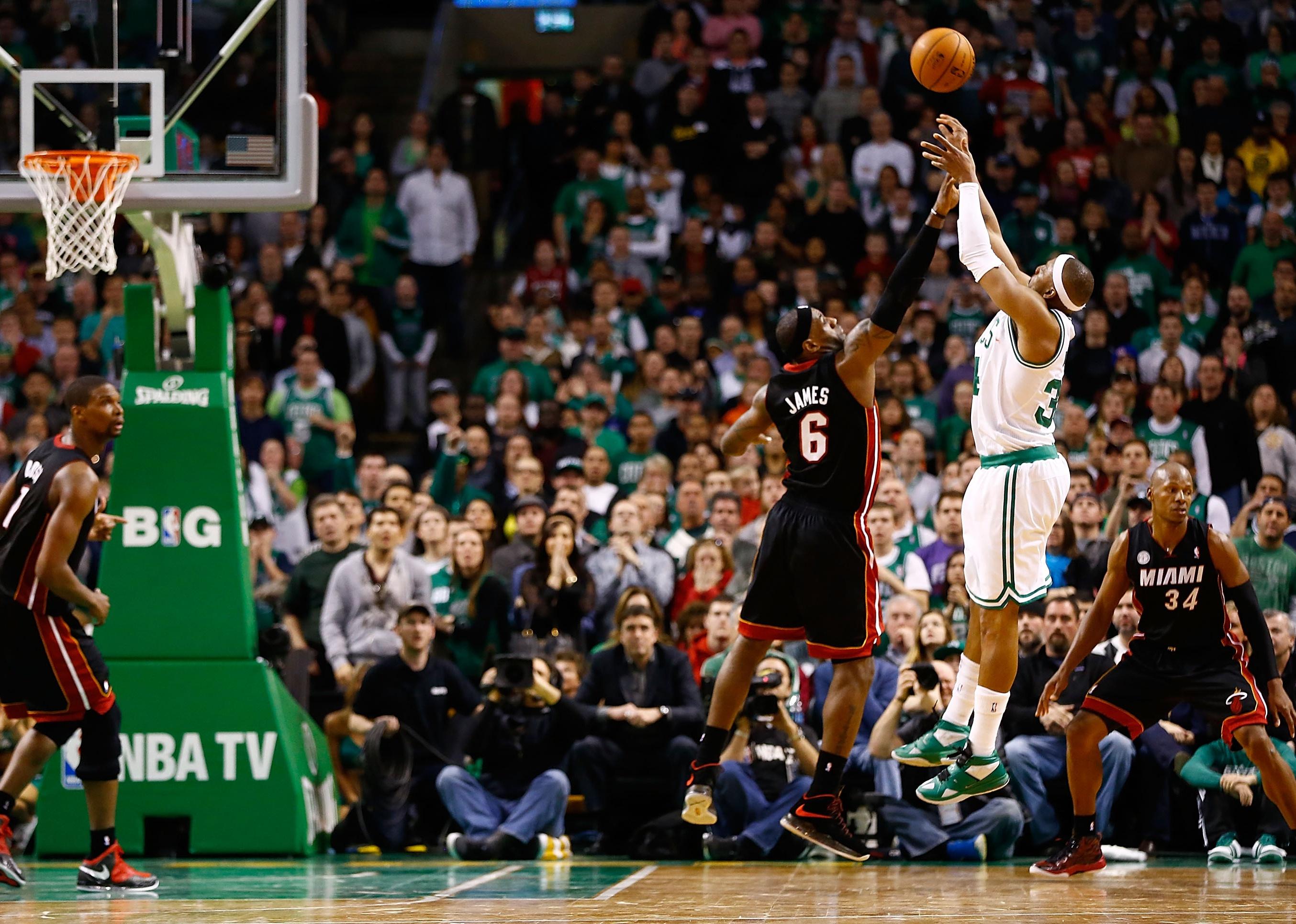 Paul Pierce #34 of the Boston Celtics takes a game-winning shot over LeBron James.