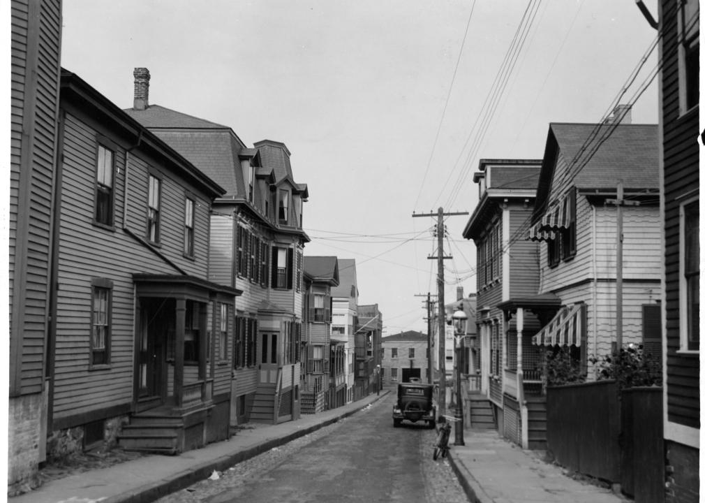 Narrow street of residential neighborhood in Newport, Rhode Island, circa 1930. 