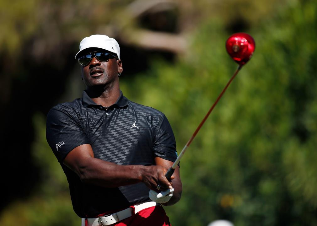 Michael Jordan hits a tee shot