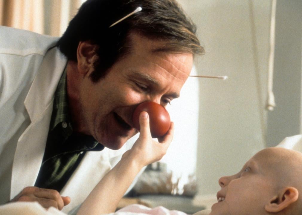 Robin Williams visits a sick child in a scene from the film 'Patch Adams'.