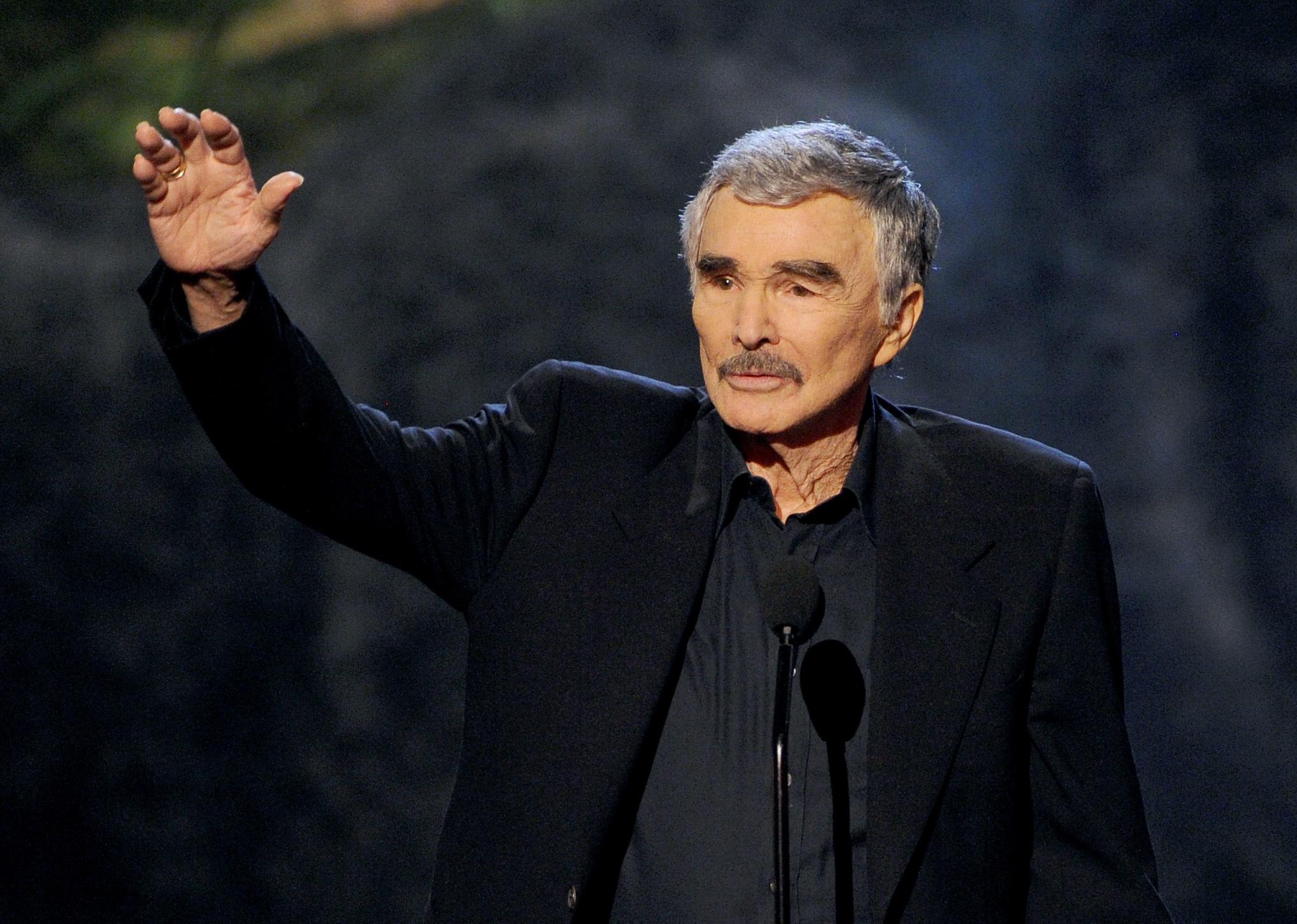 Burt Reynolds accepts award onstage during Spike TV