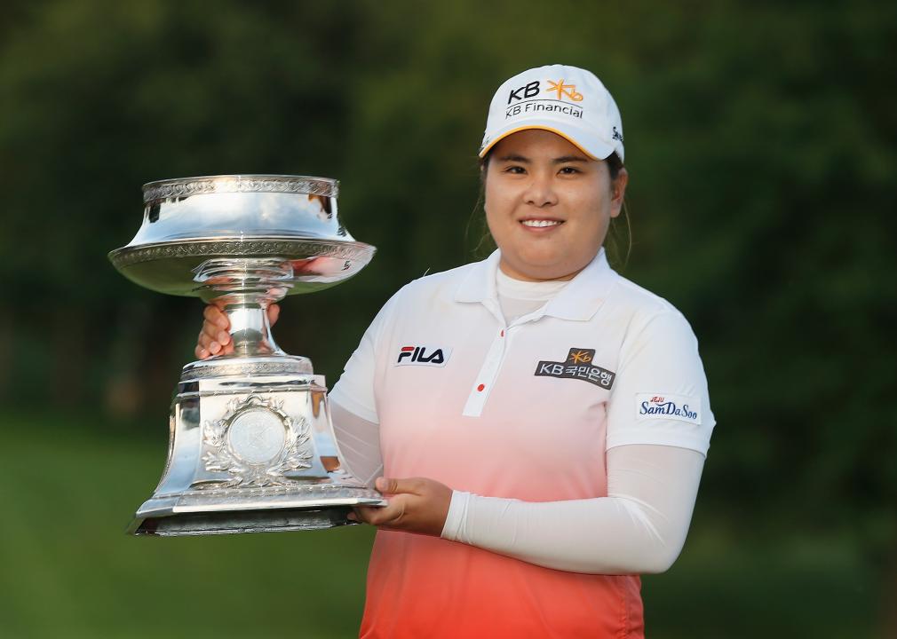 Inbee Park of South Korea poses with a trophy