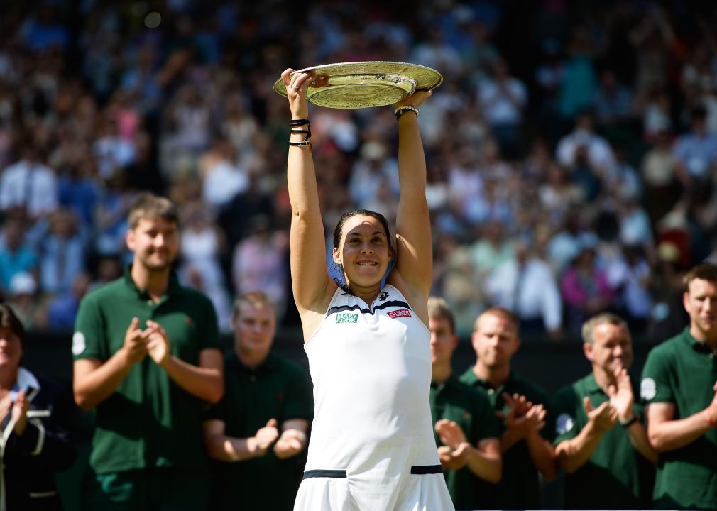 Marion Bartoli of France poses with the Venus Rosewater Dish trophy.