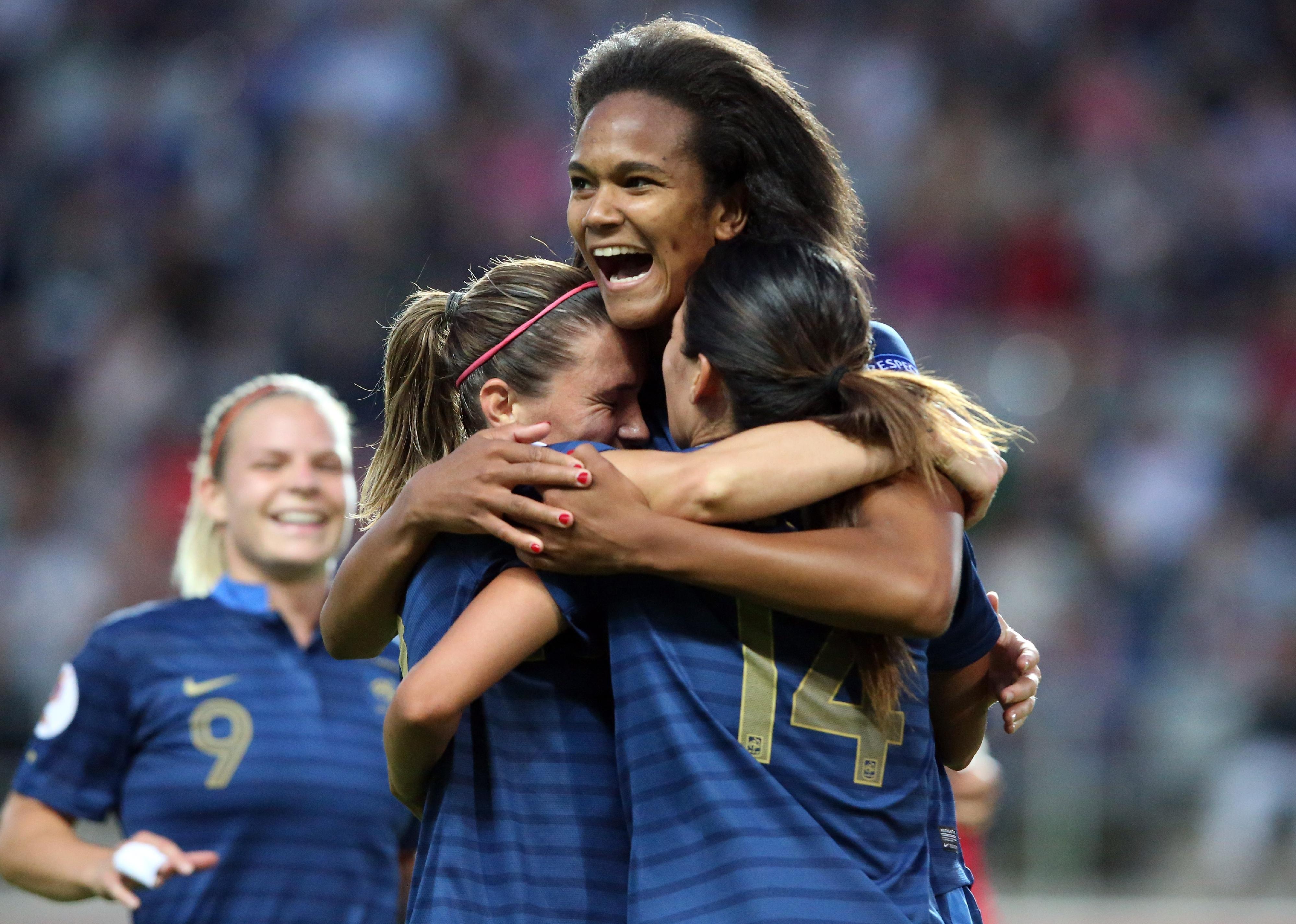 Wendie Renard of France celebrates the third goal with Camille Abily and Louisa Necib during the UEFA Women's EURO 2013 Group C match between France and England.