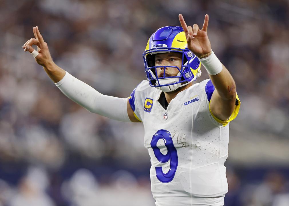 Matthew Stafford signals for a two-point conversion after a touchdown.