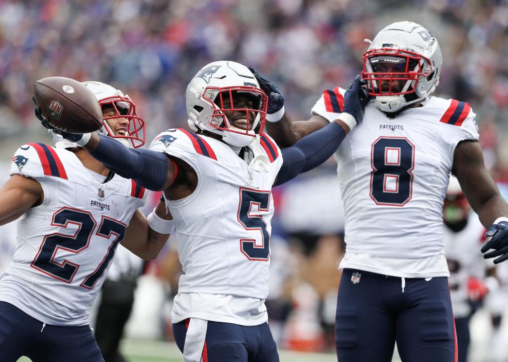 Myles Bryant, Jabrill Peppers, and Ja'Whaun Bentley of the New England Patriots celebrate after a fumble recovery.