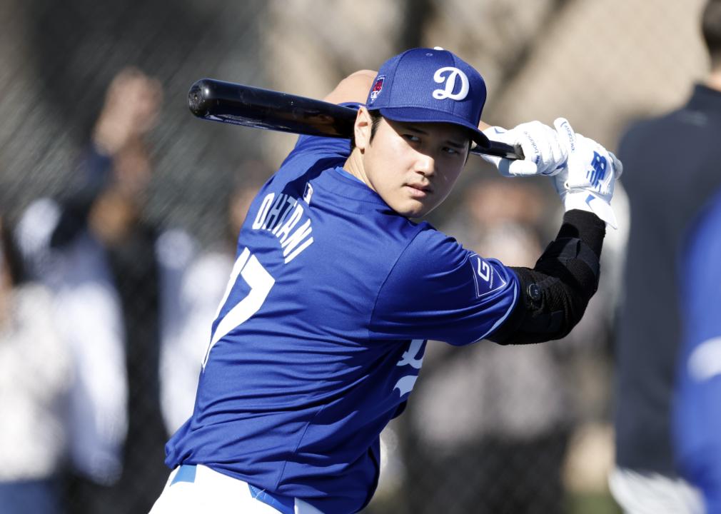 Shohei Ohtani #17 of the Los Angeles Dodgers swings the bat during workouts.