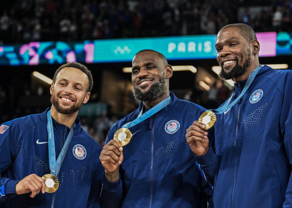 Stephen Curry, LeBron James and Kevin Durant pose after the men's Gold Medal basketball match.