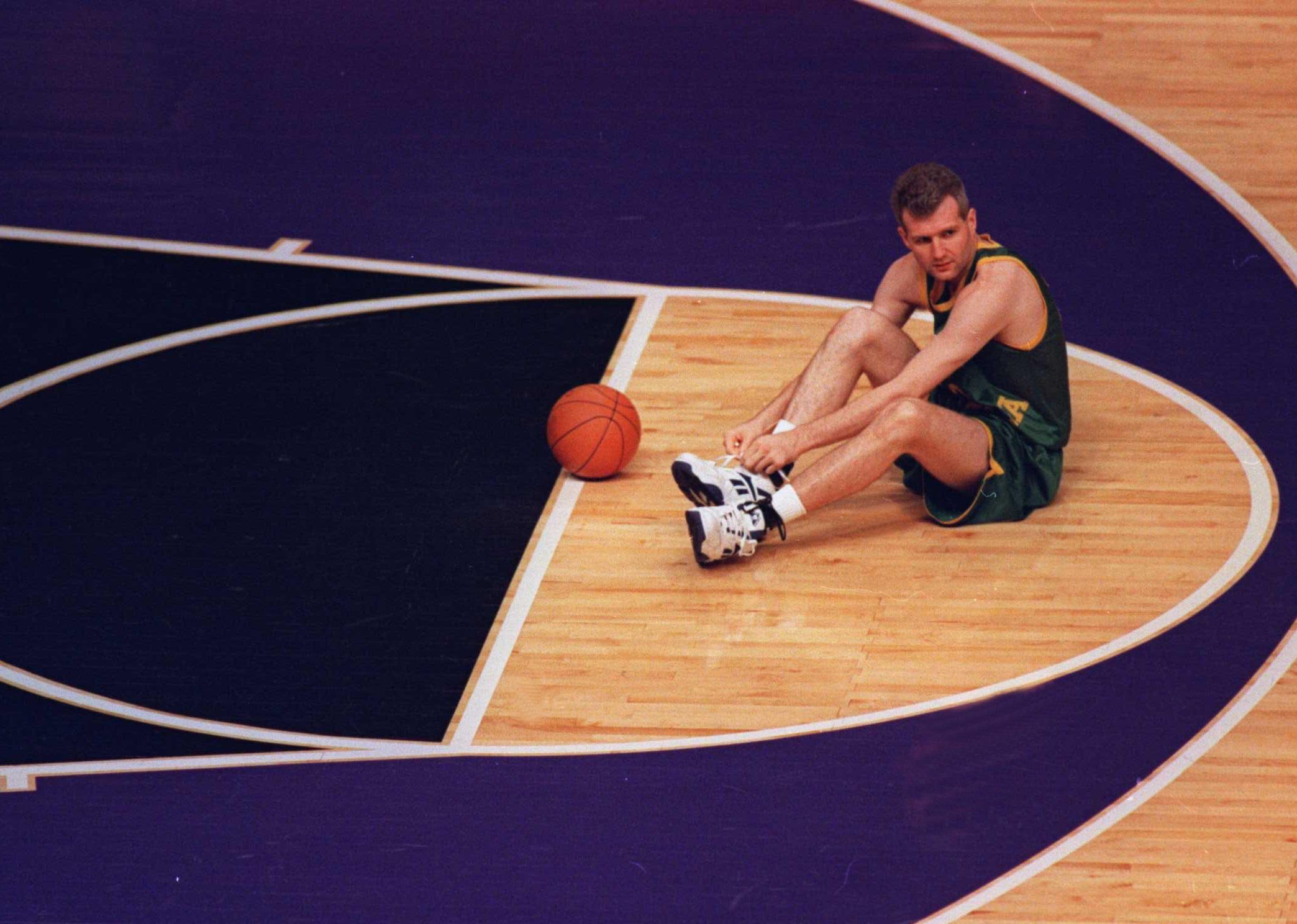 Andrew Gaze takes a time-out to tie his shoe.