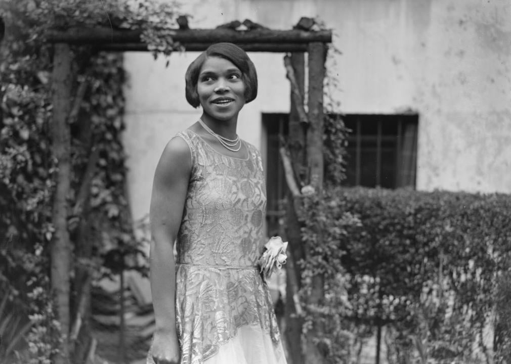 Marian Anderson standing in garden.