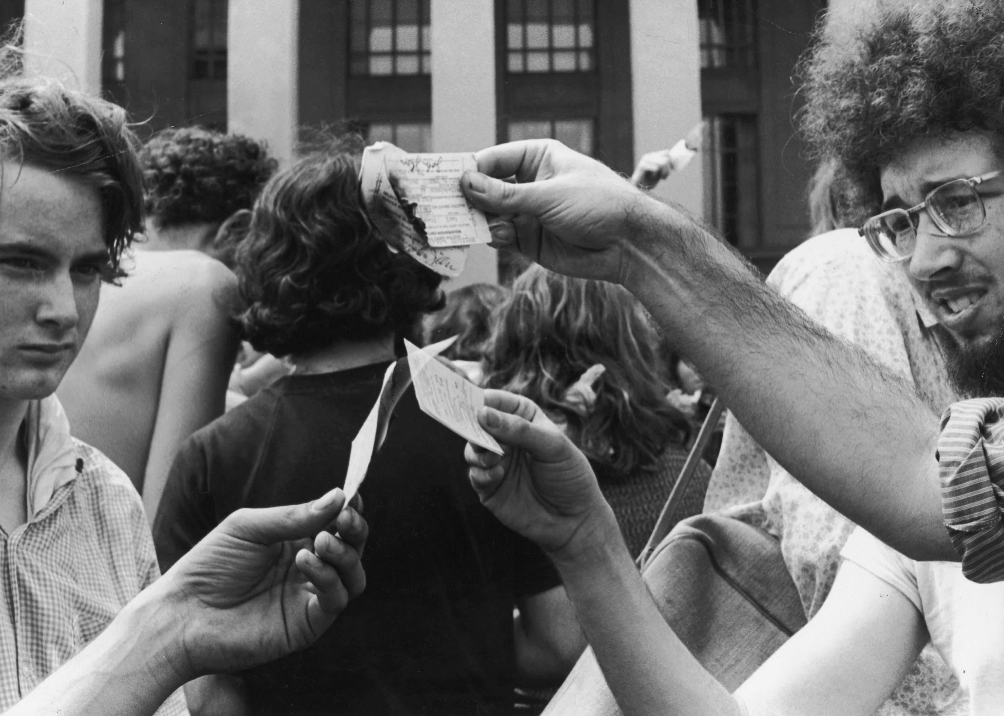 Anti-war demonstrators burn their draft cards on the steps of the Pentagon during the Vietnam War.