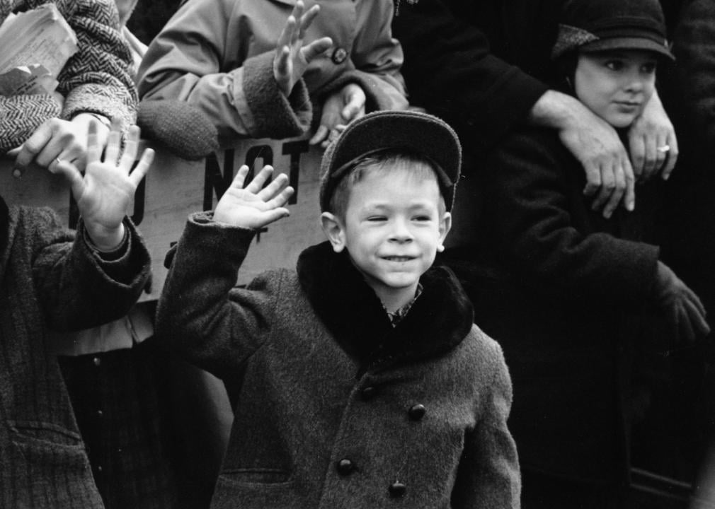 A little boy waves during the parade in New York City.