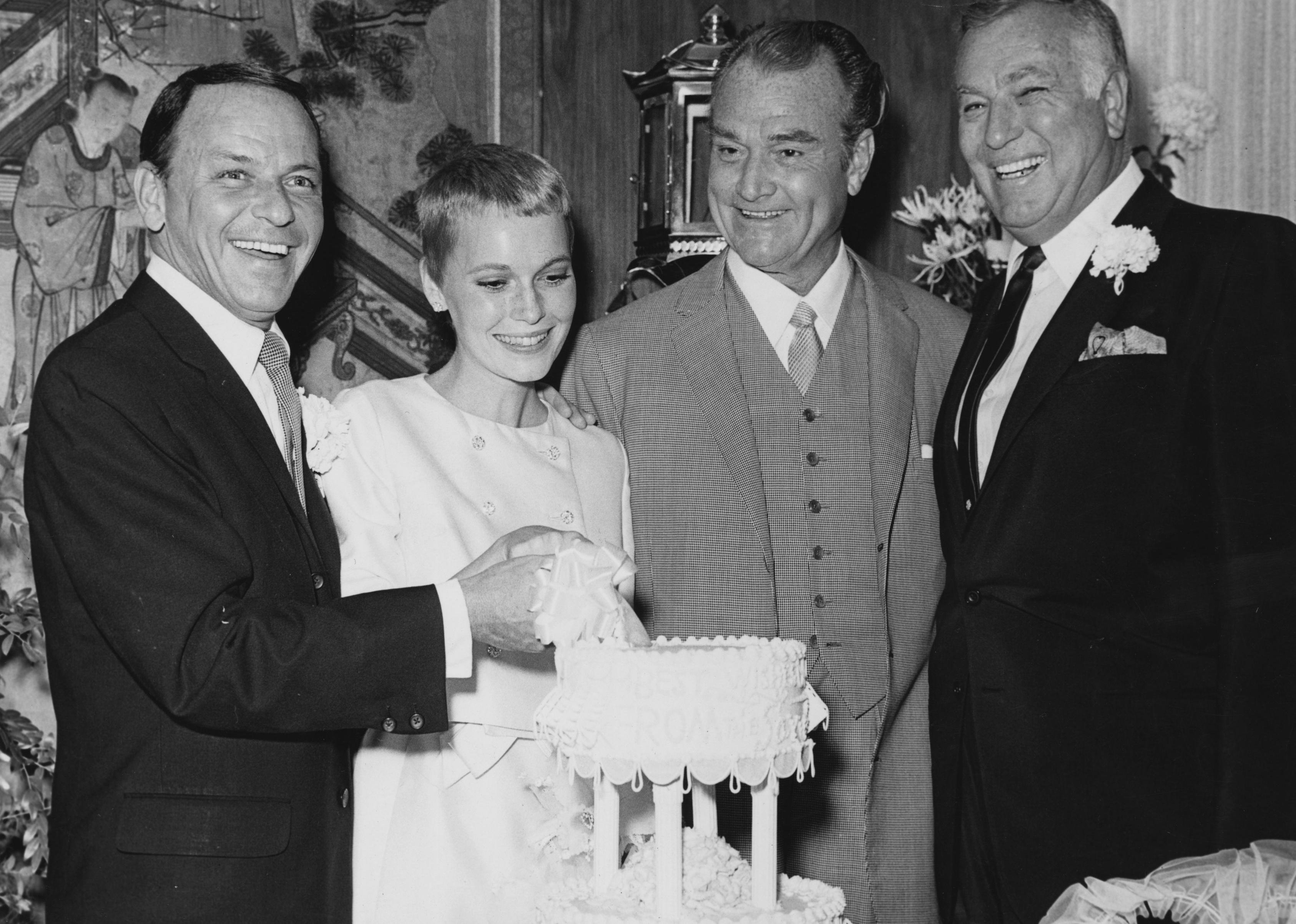 Frank Sinatra with actress Mia Farrow on their wedding day at Las Vegas with Red Skelton.
