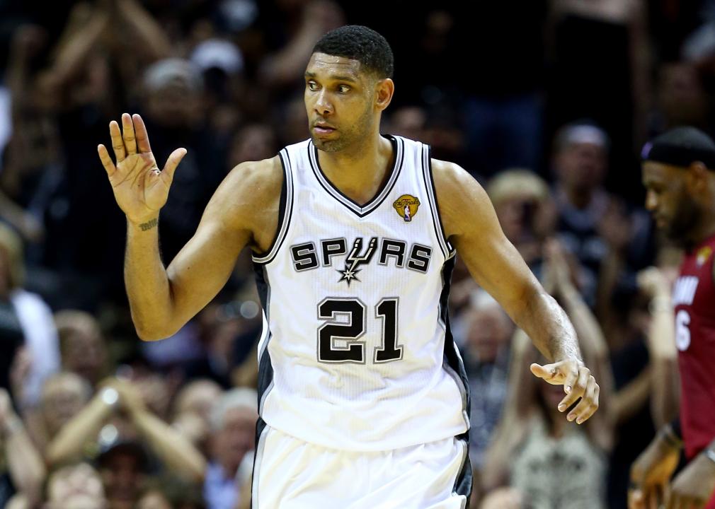 Tim Duncan with a hand up looking to the side during a game